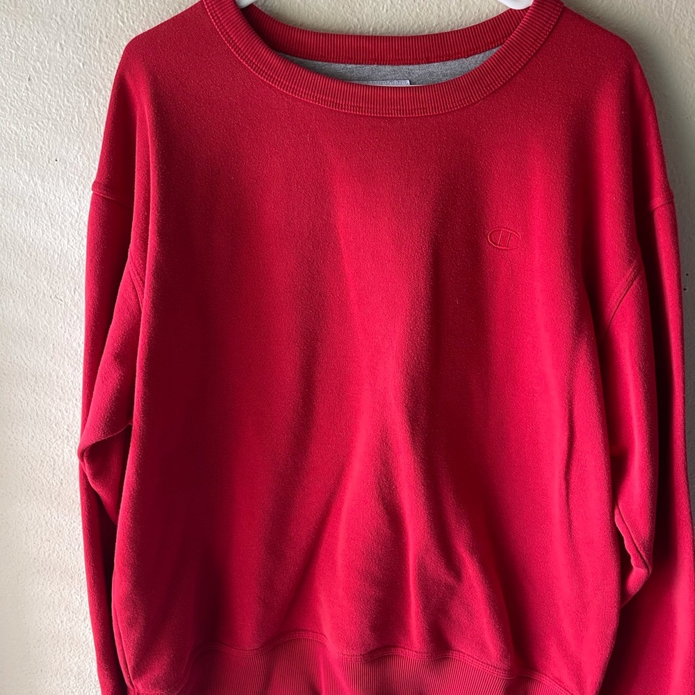 Red Champion crew neck in good condition size L